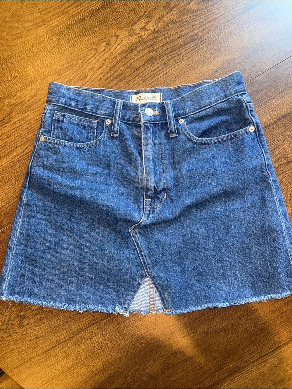 Madewell denim mini skirt with a raw hem and A-line silhouette Size 25